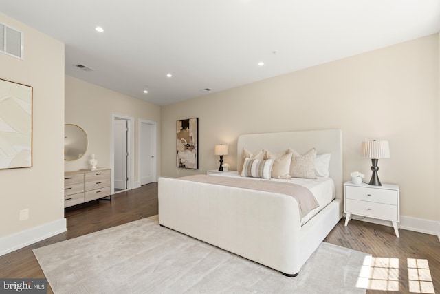bedroom with recessed lighting, baseboards, visible vents, and wood finished floors