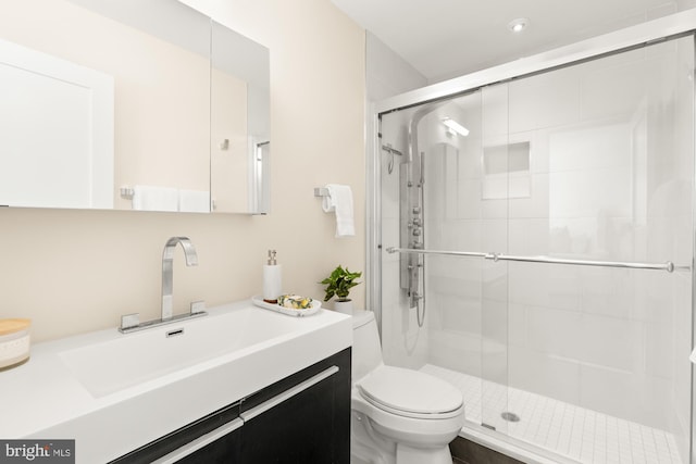 full bath with vanity, recessed lighting, toilet, and a shower stall
