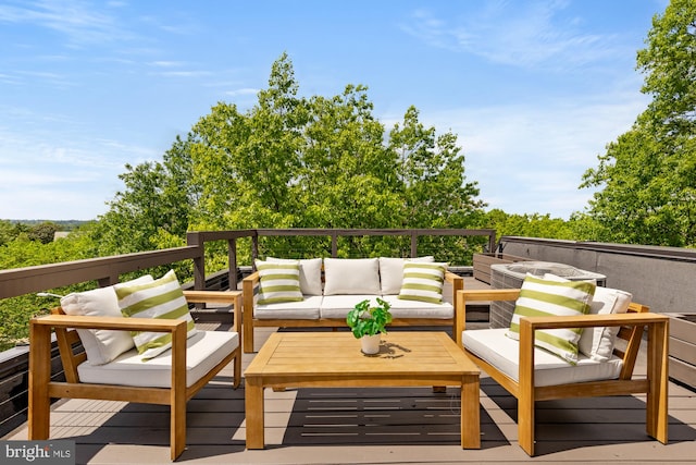 wooden terrace with an outdoor hangout area