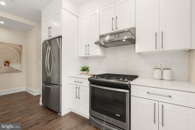 kitchen with under cabinet range hood, stainless steel appliances, white cabinetry, and dark wood-type flooring