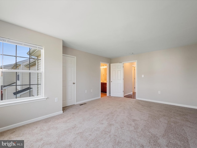 119 Checko Ct, Martinsburg, WV 25401 - unfurnished bedroom with carpet flooring, baseboards, and connected bathroom