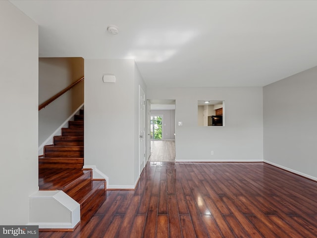 119 Checko Ct, Martinsburg, WV 25401 - unfurnished living room featuring baseboards, stairs, and wood finished floors