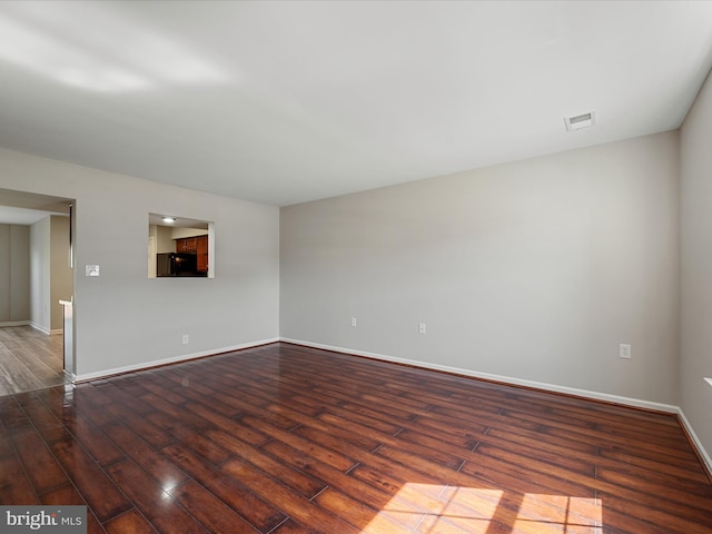 119 Checko Ct, Martinsburg, WV 25401 - unfurnished living room with baseboards, visible vents, and wood finished floors