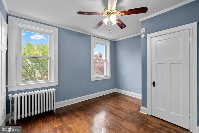 4208 Sheldon Ave, Baltimore, MD 21206 - unfurnished room featuring radiator, baseboards, dark wood finished floors, ornamental molding, and a ceiling fan