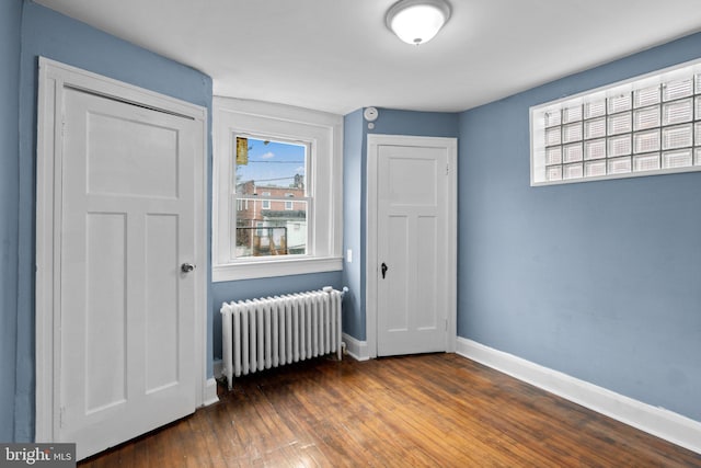 4208 Sheldon Ave, Baltimore, MD 21206 - unfurnished bedroom featuring radiator heating unit, baseboards, and wood-type flooring