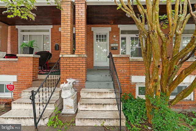 4208 Sheldon Ave, Baltimore, MD 21206 - doorway to property featuring brick siding and a porch
