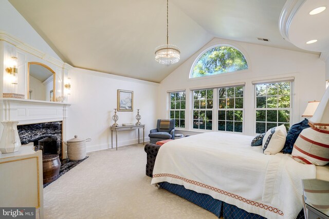 bedroom with visible vents, a notable chandelier, a premium fireplace, and lofted ceiling
