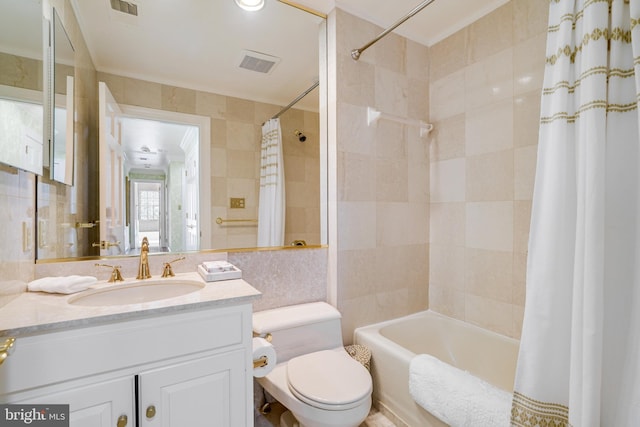 full bathroom featuring tile walls, shower / bath combo with shower curtain, toilet, and visible vents