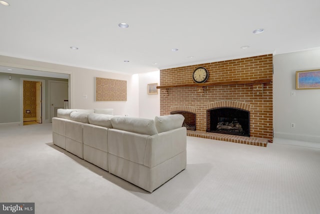 living area featuring a fireplace, baseboards, light carpet, and recessed lighting