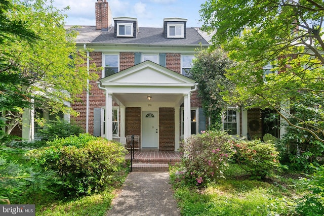 216 Homewood Ter, Baltimore, MD 21218 - view of front facade with brick siding and a chimney