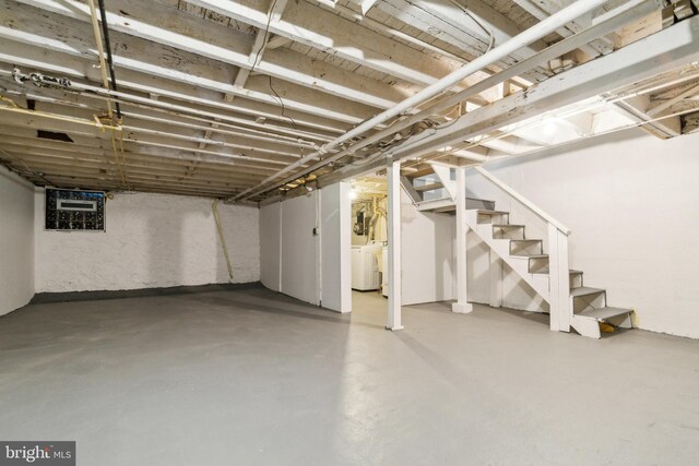 216 Homewood Ter, Baltimore, MD 21218 - unfinished below grade area featuring stairway and washer and dryer