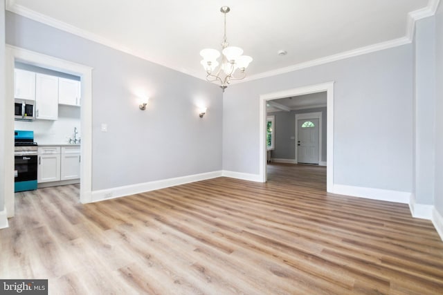 216 Homewood Ter, Baltimore, MD 21218 - unfurnished dining area featuring a chandelier, ornamental molding, baseboards, light wood-style floors, and a sink