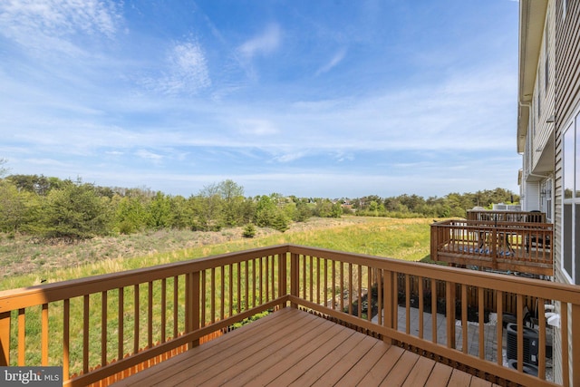 wooden terrace featuring central air condition unit