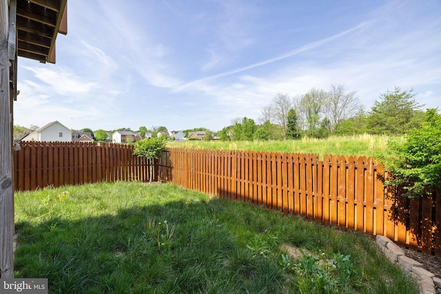 view of yard with a fenced backyard