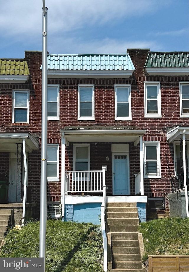 2526 W Franklin St, Baltimore, MD 21223 - multi unit property featuring a tiled roof and brick siding