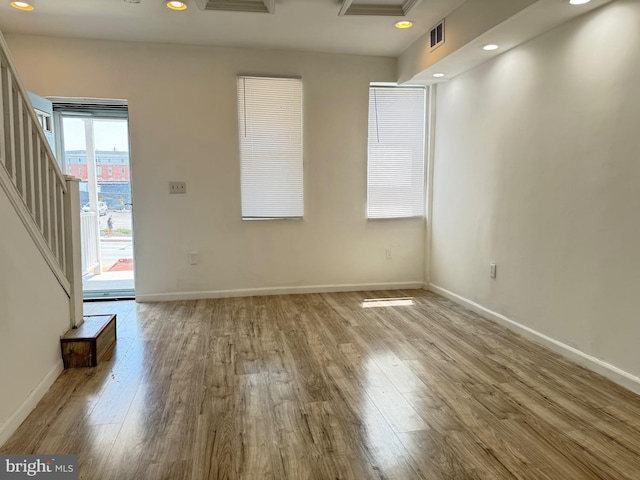2526 W Franklin St, Baltimore, MD 21223 - unfurnished living room featuring recessed lighting, baseboards, visible vents, and wood finished floors