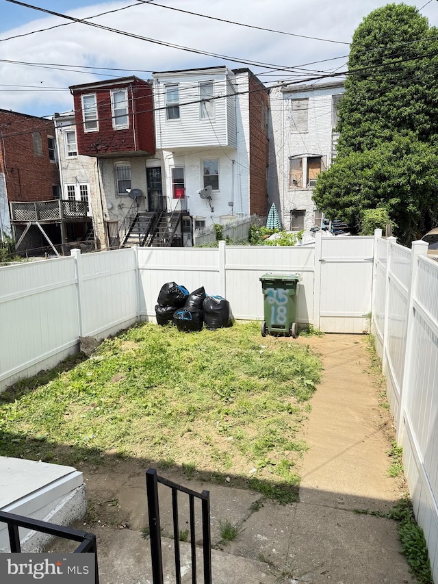2526 W Franklin St, Baltimore, MD 21223 - view of yard with a gate and a fenced backyard