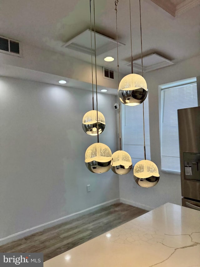 2526 W Franklin St, Baltimore, MD 21223 - interior space featuring visible vents, crown molding, wood finished floors, and stainless steel fridge
