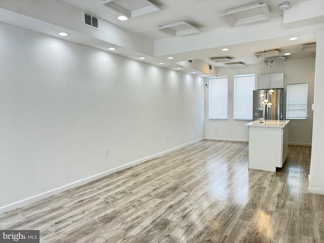 2526 W Franklin St, Baltimore, MD 21223 - spare room with light wood-style floors, attic access, recessed lighting, baseboards, and visible vents