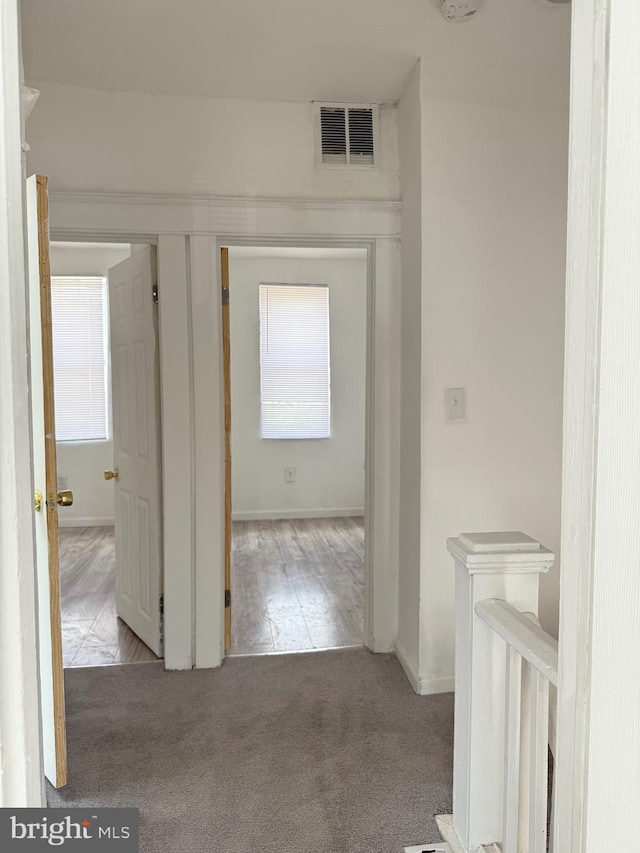 2526 W Franklin St, Baltimore, MD 21223 - hallway with baseboards, carpet flooring, and visible vents