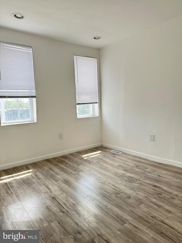 2526 W Franklin St, Baltimore, MD 21223 - empty room with baseboards and wood finished floors