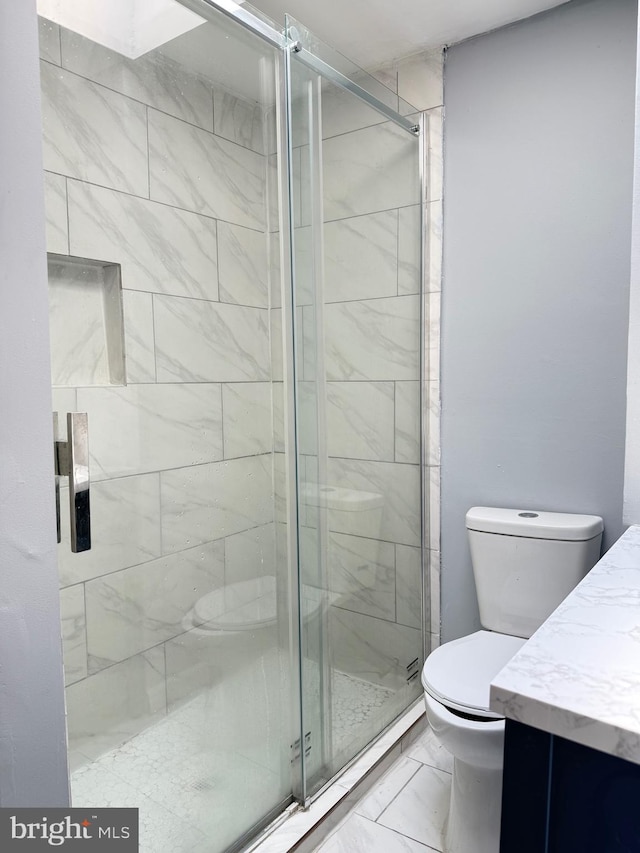 2526 W Franklin St, Baltimore, MD 21223 - bathroom with vanity, marble finish floor, toilet, and a shower stall