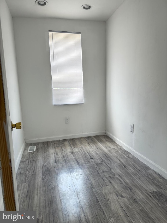 2526 W Franklin St, Baltimore, MD 21223 - unfurnished room featuring baseboards, visible vents, and wood finished floors