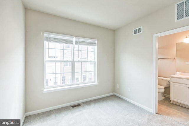 12526 Adobe Aly, Beltsville, MD 20705 - unfurnished bedroom with light colored carpet, baseboards, and visible vents