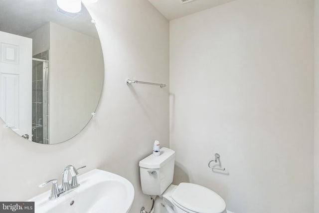 12526 Adobe Aly, Beltsville, MD 20705 - full bath featuring visible vents, a sink, an enclosed shower, and toilet