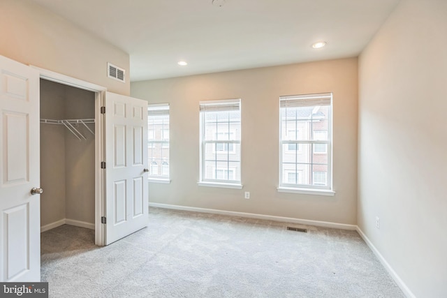 12526 Adobe Aly, Beltsville, MD 20705 - unfurnished bedroom featuring a walk in closet, carpet, and visible vents
