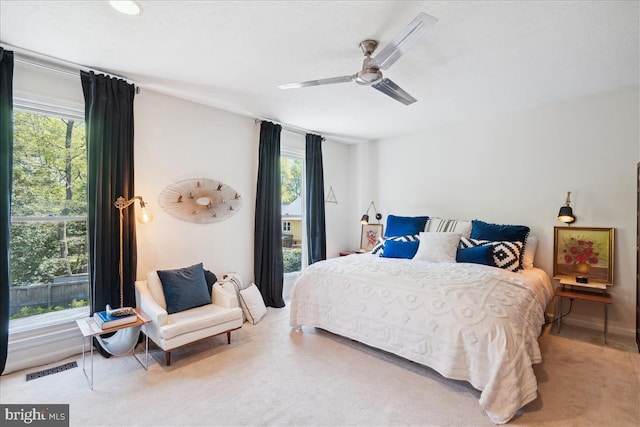 bedroom featuring a ceiling fan and visible vents