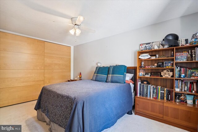 carpeted bedroom featuring ceiling fan