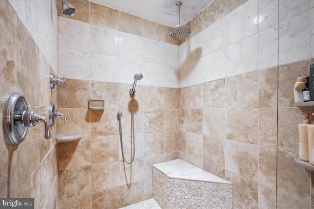 full bath featuring tiled shower