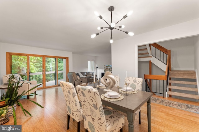 11645 Newbridge Ct, Reston, VA 20191 - dining room featuring a chandelier, wood finished floors, and stairway