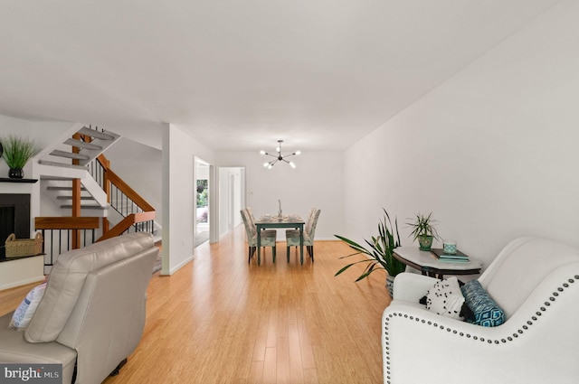 11645 Newbridge Ct, Reston, VA 20191 - dining room with stairs, light wood-type flooring, and a chandelier