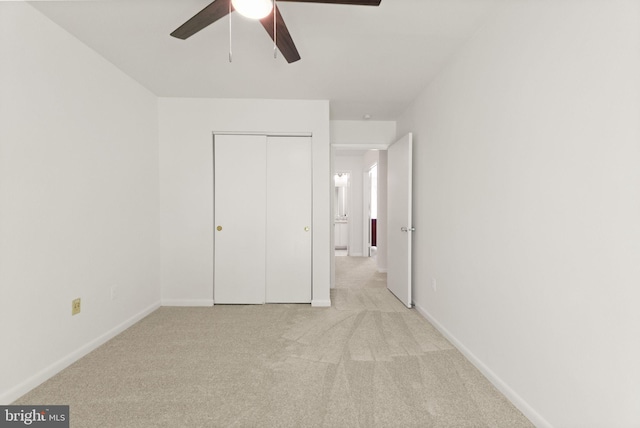 11645 Newbridge Ct, Reston, VA 20191 - unfurnished bedroom with light carpet, a closet, baseboards, and a ceiling fan