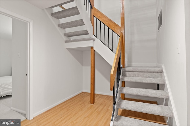 11645 Newbridge Ct, Reston, VA 20191 - stairs featuring wood finished floors and baseboards