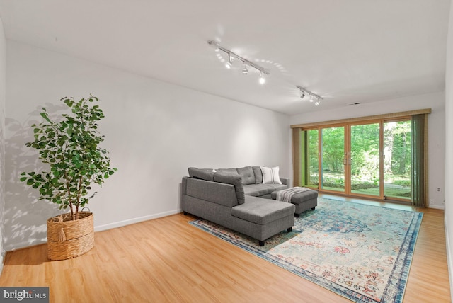 11645 Newbridge Ct, Reston, VA 20191 - living room featuring wood finished floors, baseboards, and rail lighting