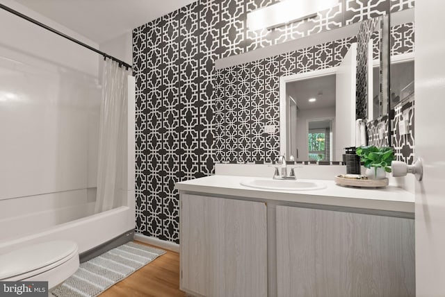 11645 Newbridge Ct, Reston, VA 20191 - full bath with vanity, toilet, shower / tub combo, wood finished floors, and wallpapered walls