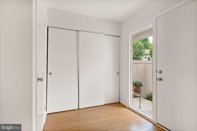 11645 Newbridge Ct, Reston, VA 20191 - unfurnished bedroom with light wood-style floors, access to outside, and a closet