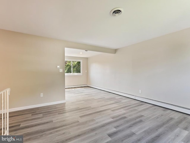 14 Featherbed Ln, Norristown, PA 19403 - unfurnished room featuring baseboards, a baseboard radiator, wood finished floors, and visible vents