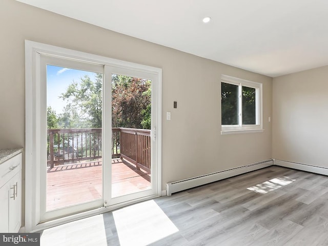 14 Featherbed Ln, Norristown, PA 19403 - doorway with recessed lighting, a baseboard heating unit, and light wood-type flooring