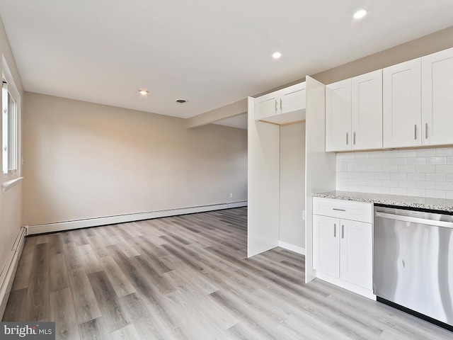 14 Featherbed Ln, Norristown, PA 19403 - kitchen featuring light stone counters, a baseboard radiator, white cabinetry, tasteful backsplash, and stainless steel dishwasher
