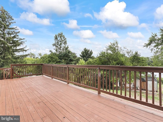 14 Featherbed Ln, Norristown, PA 19403 - wooden deck featuring a shed and an outbuilding