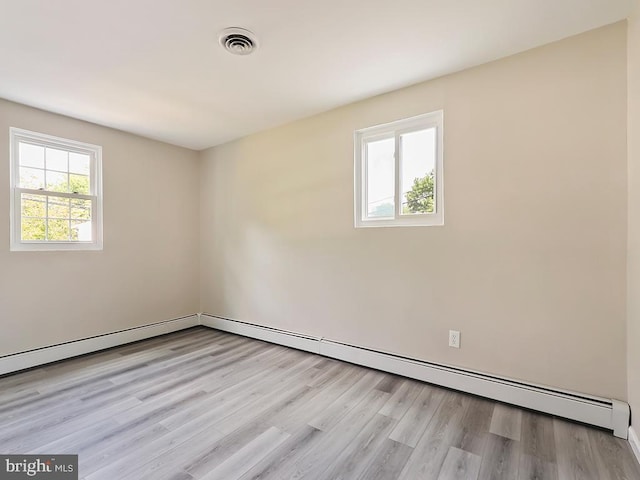 14 Featherbed Ln, Norristown, PA 19403 - unfurnished room with visible vents, a baseboard radiator, and light wood-style flooring