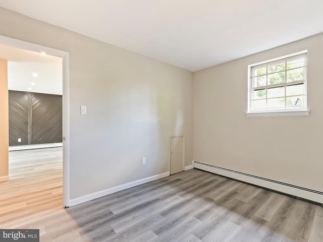 14 Featherbed Ln, Norristown, PA 19403 - spare room with baseboards, a baseboard radiator, and wood finished floors