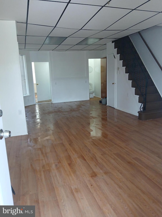 interior space with wood finished floors and stairway
