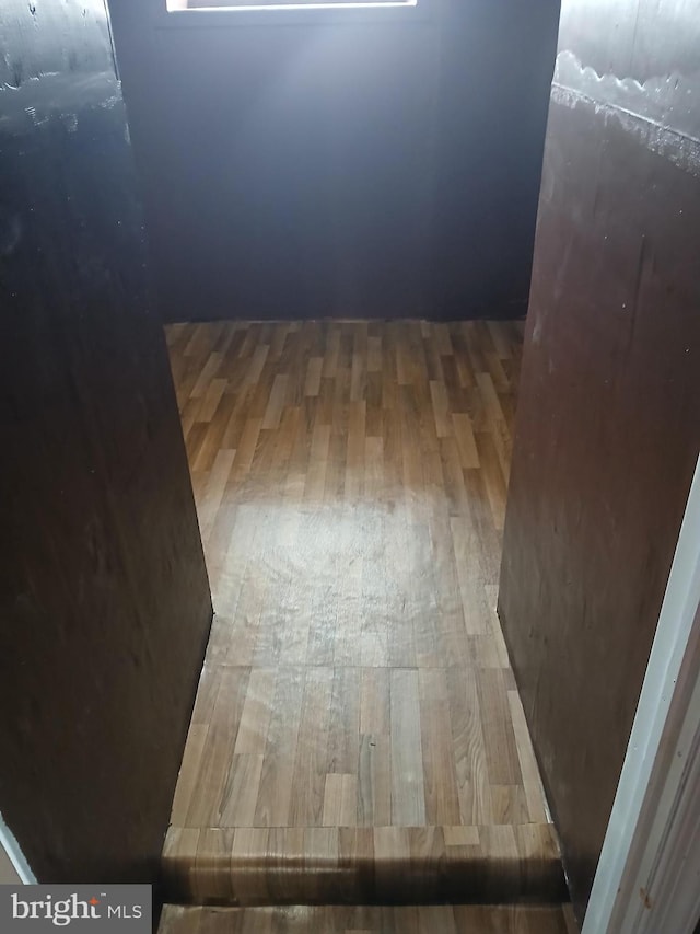 unfurnished room with wood finished floors