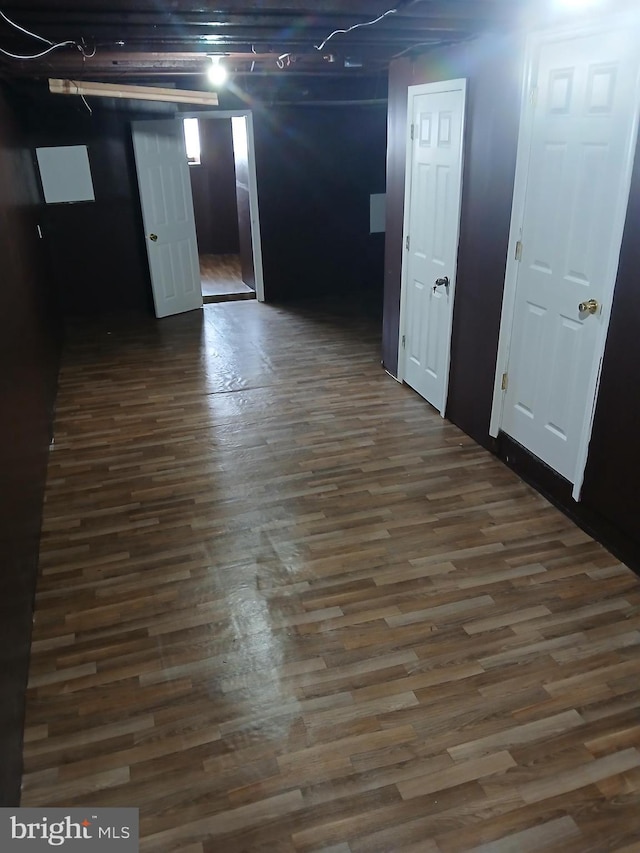 basement featuring dark wood finished floors