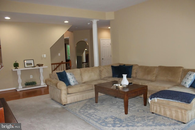 living room with recessed lighting, baseboards, ornate columns, and wood finished floors